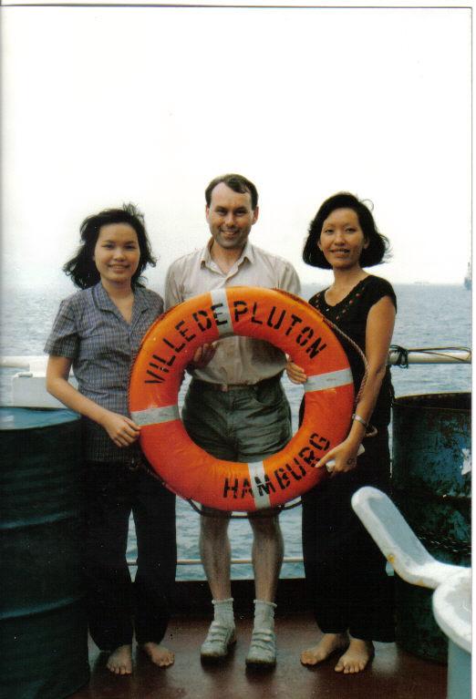 Lyn Tran, her sister, and a crew member of a German Ship that found them as refugees