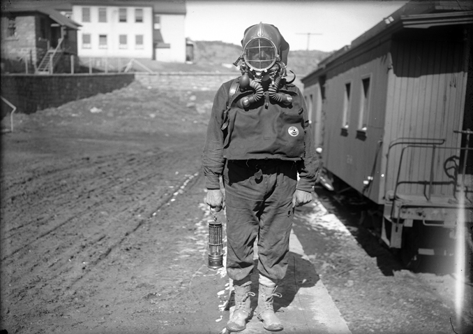A man in a mine rescue suit, taken by Otis Aultman, c. 1890.