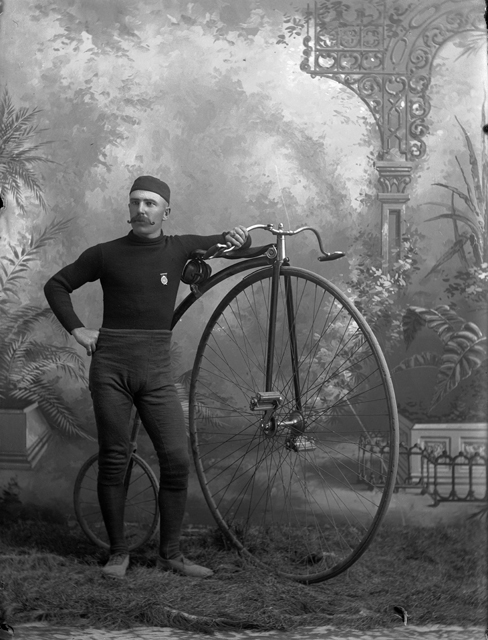 Studio portrait of W.F. Blake with bicycle, taken with Oliver Aultman c. 1890.