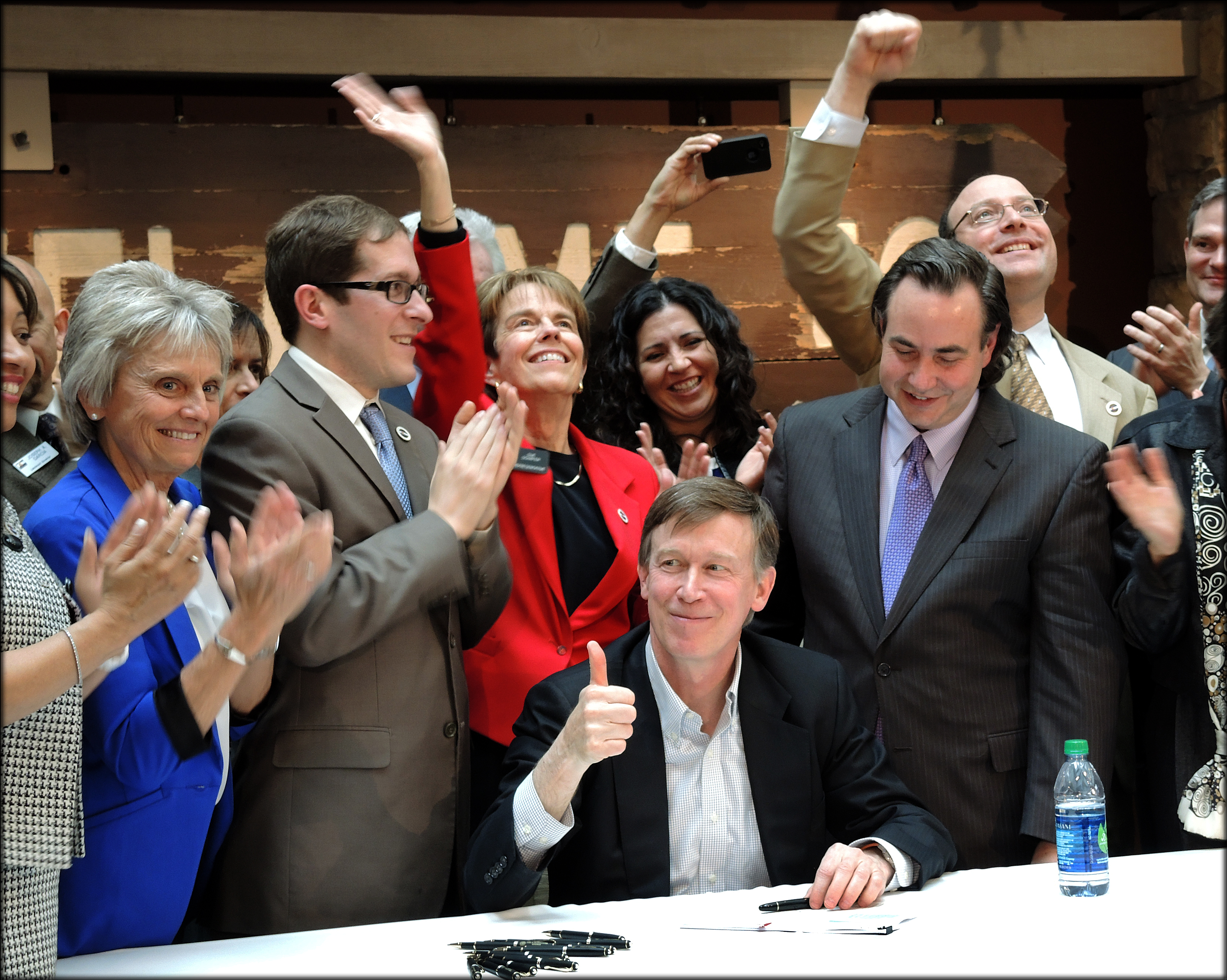 Governor Hickenlooper signs the historic Colorado Civil Union Act into law. Around him are Reps. Joann Ginal and Sue Schafer, Sen. Pat Steadman, and Speaker of the House Mark Ferrandino.