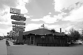 Black and white photo of a Googie Style restuarant.