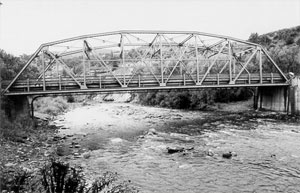 A black and white photo of the bridge