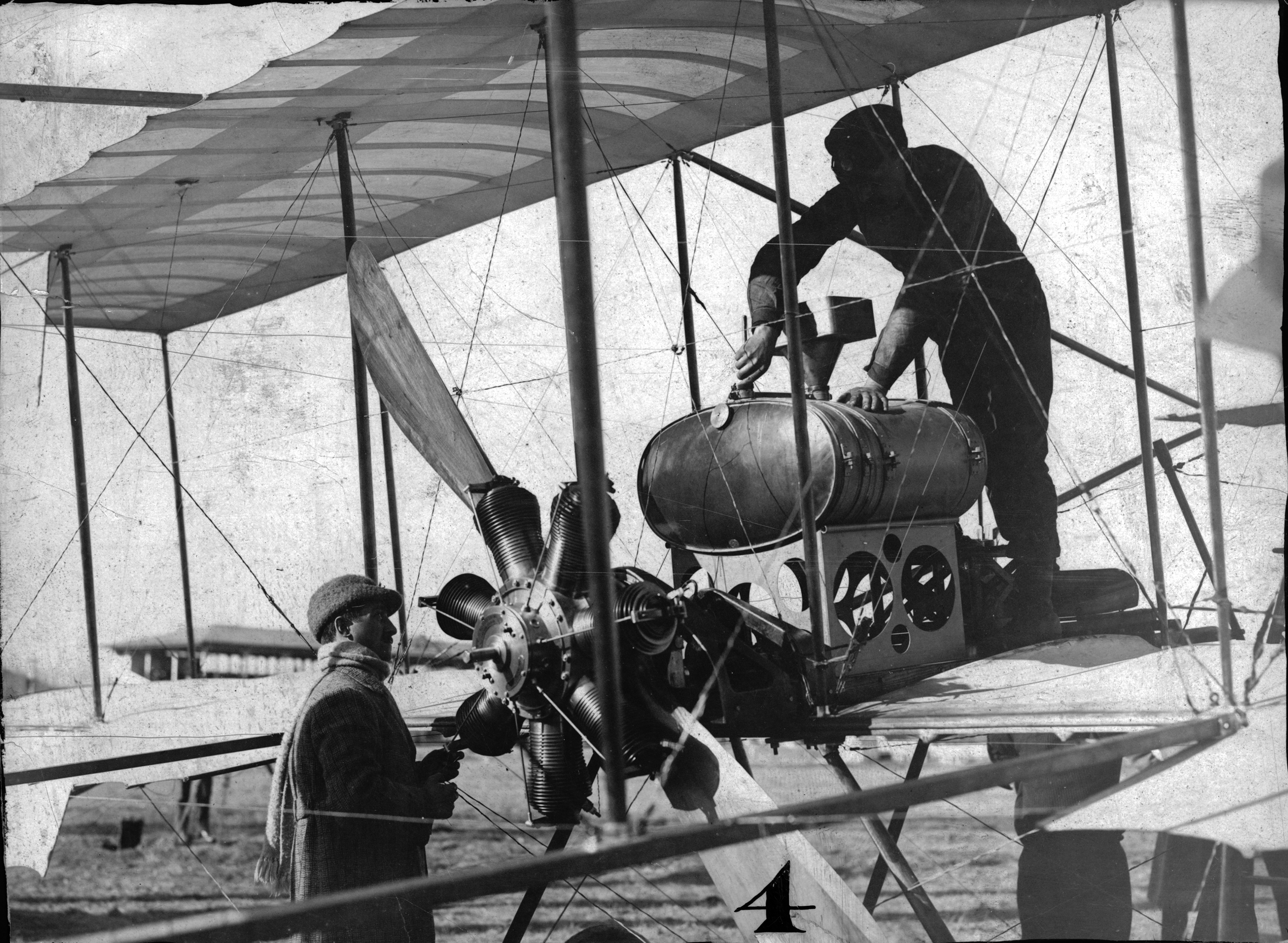 Louis Paulhan and his airplane in 1910