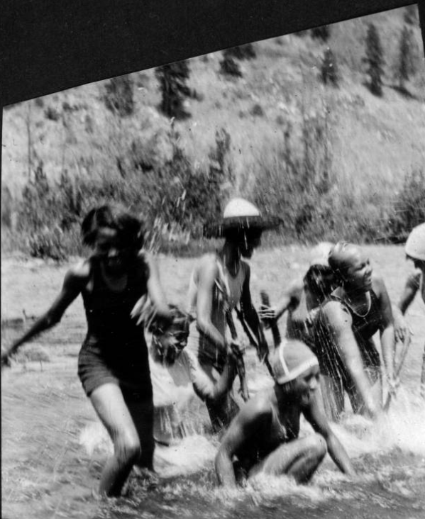 Young women splashing in river at Camp Nizhoni, 1929 or 1930
