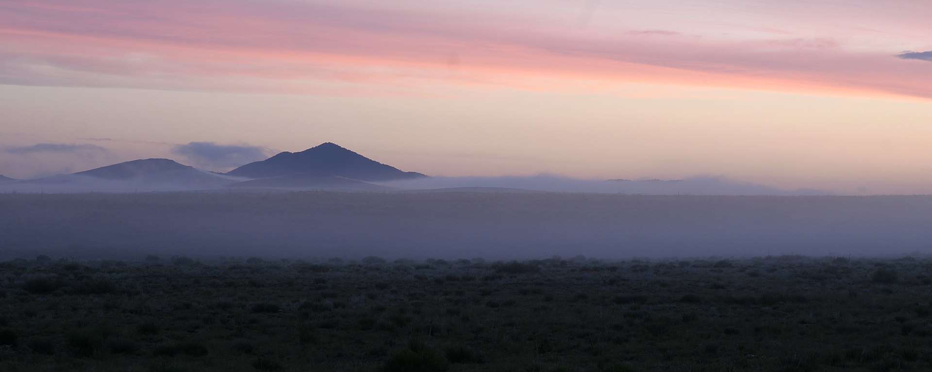 View of the Wet Mountain Valley in the San Isabel National Forest, shrouded in a morning mist