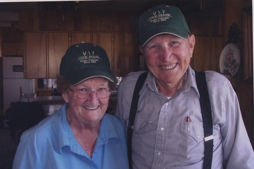 Members of the Crook Ranch proudly show off hats with the ranch brand.