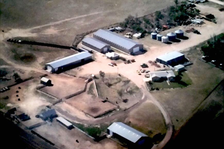A present day aerial view of the Dickinson Farm and Ranch showing a mix of new and old buildings.
