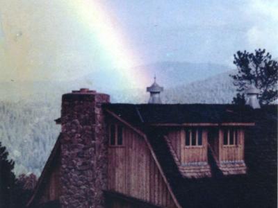 A rainbow stretches over Caribou Ranch in the mid-1970s.