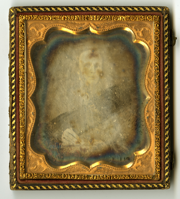 Image of a faded daguerreotype that has been damaged by exposure to air