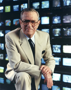 Bill Daniels in front of multiple video screens; cover shot for Relentless book, 1990s.