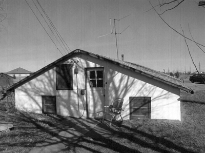 Black and white photo of a basement house.