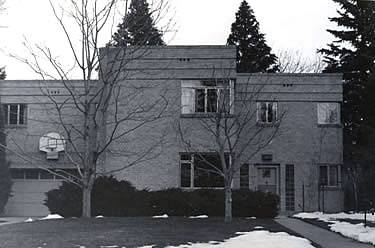 Black and white photograph depicting a Moderne style house  