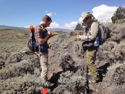 Two archaeologists using a GPS on a PAAC survey.