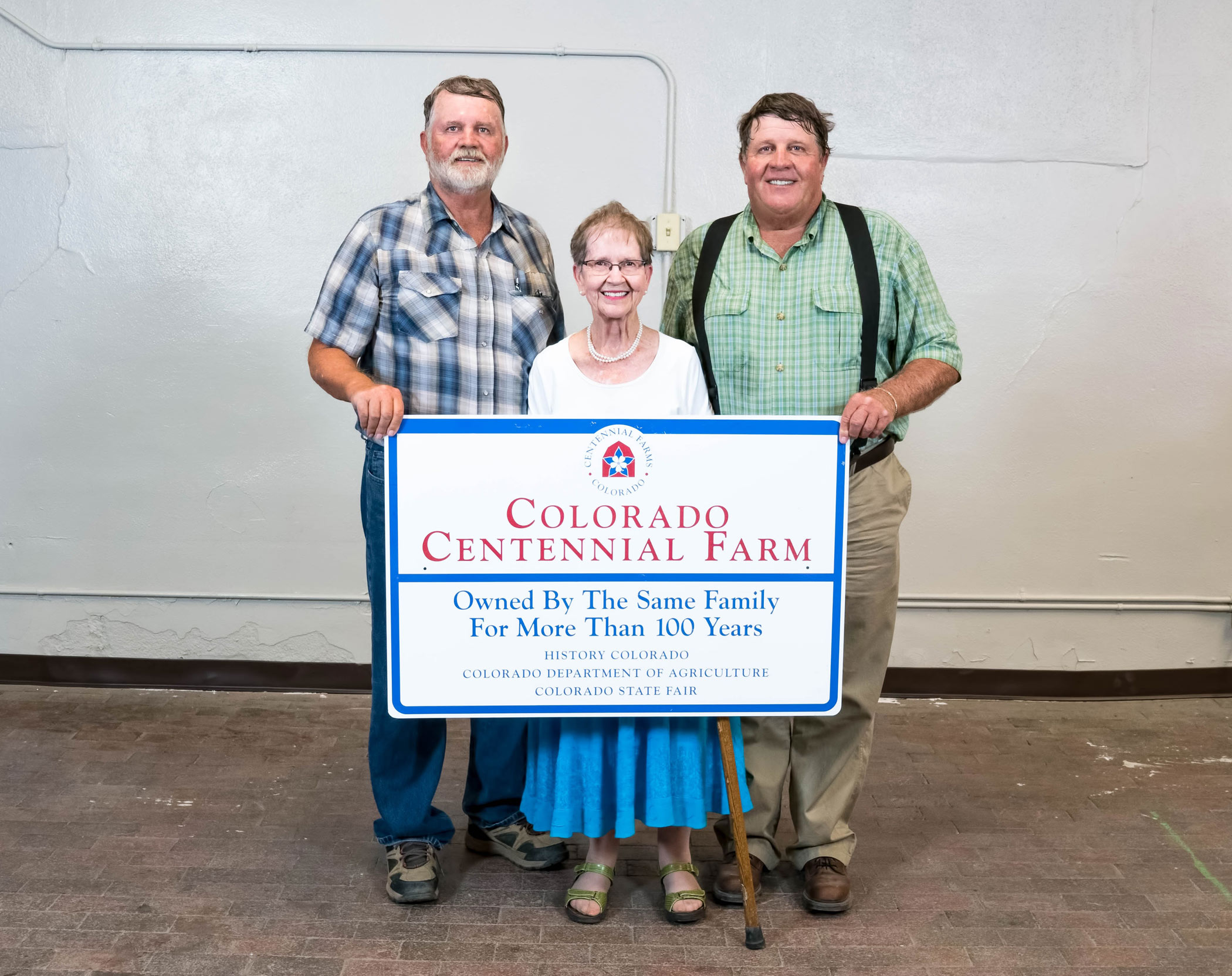 The Hasart family with their Centennial Farm sign.