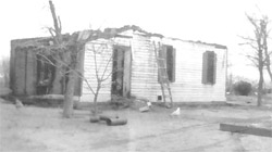 Historic image of a semi-collapsed building at Fast Heritage Farm.