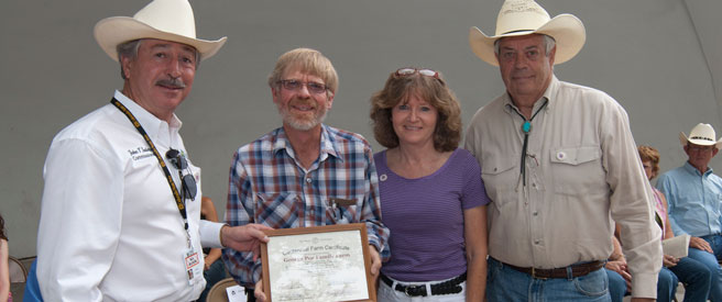 Poe Family Farm members receive their Centennial Farm award.
