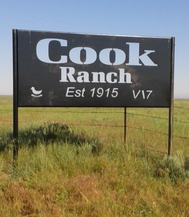Cook Ranch sign showing the ranch's brand.