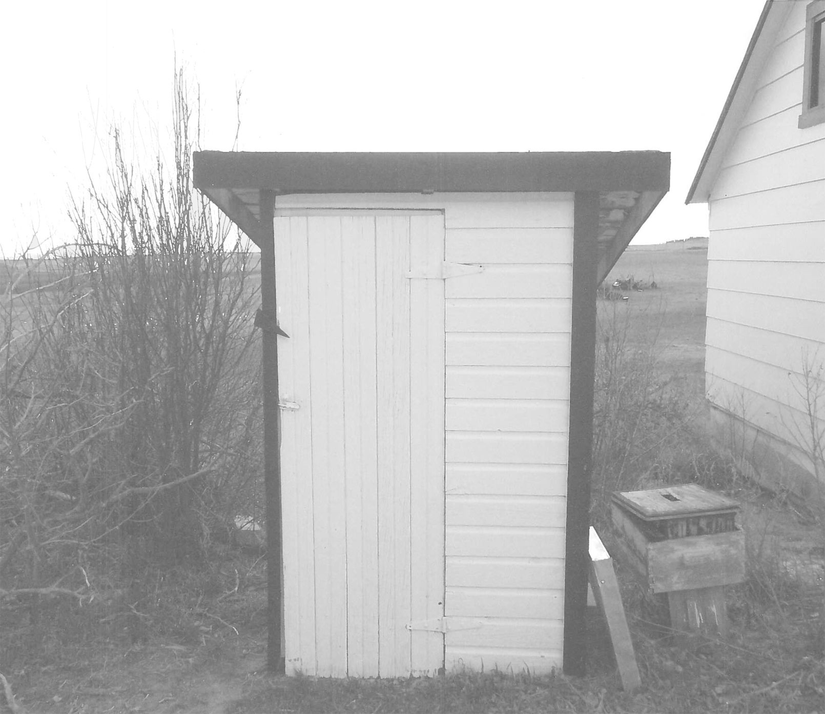 Wood frame WPA privy built on the George Eurich Farm in 1936.