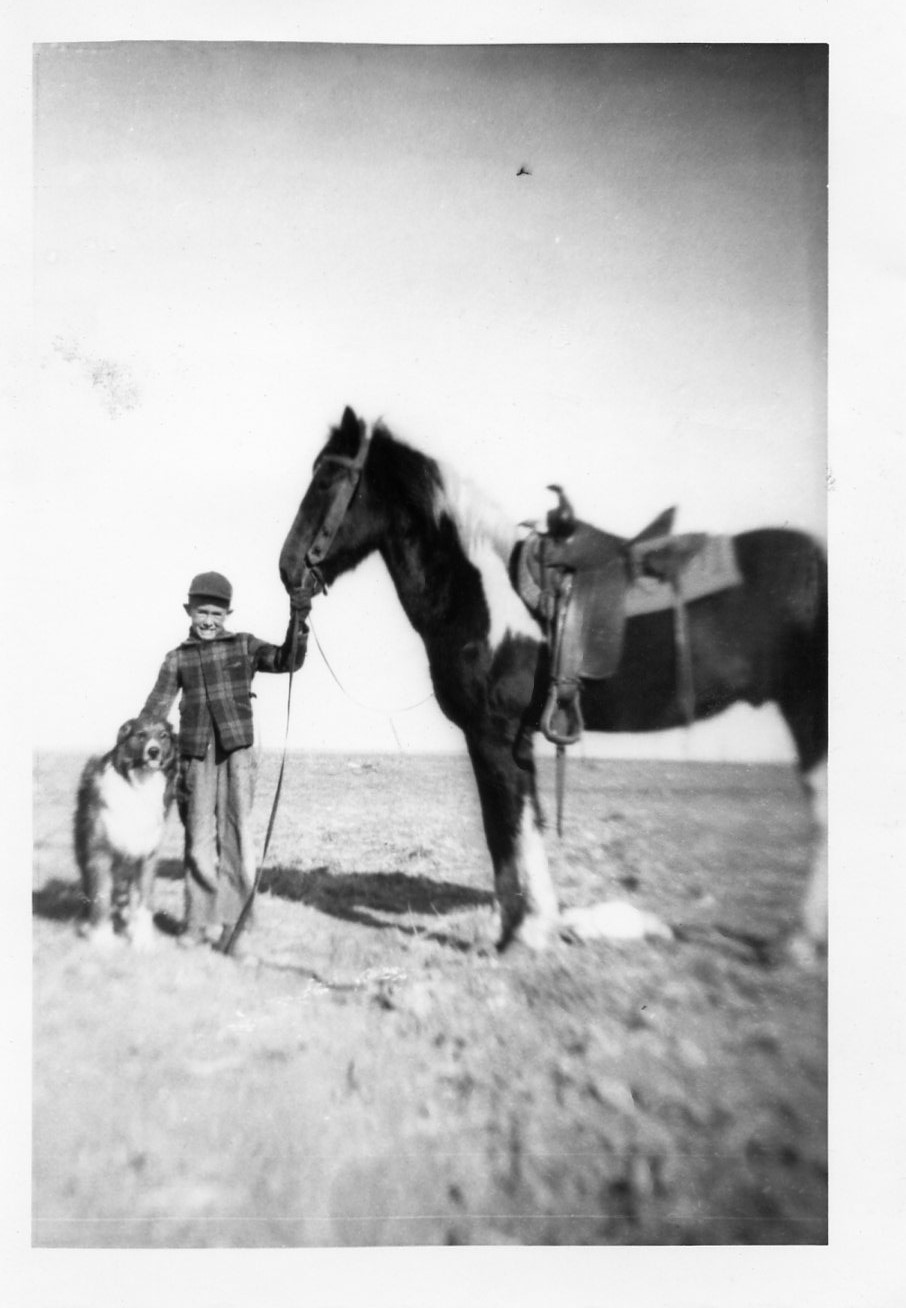 Historic photo of a boy, his dog, and his horse on the Weirich Ranch.