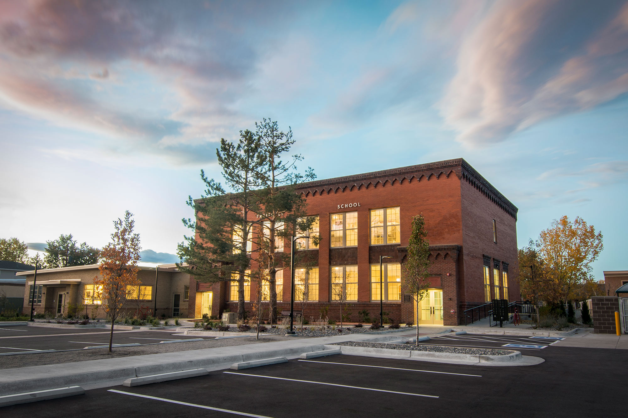 The converted, red brick Fruitdale Elementary School in Wheat Ridge, at sunset (October 2017).