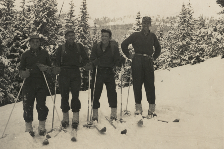 Photograph of four soldiers on skis