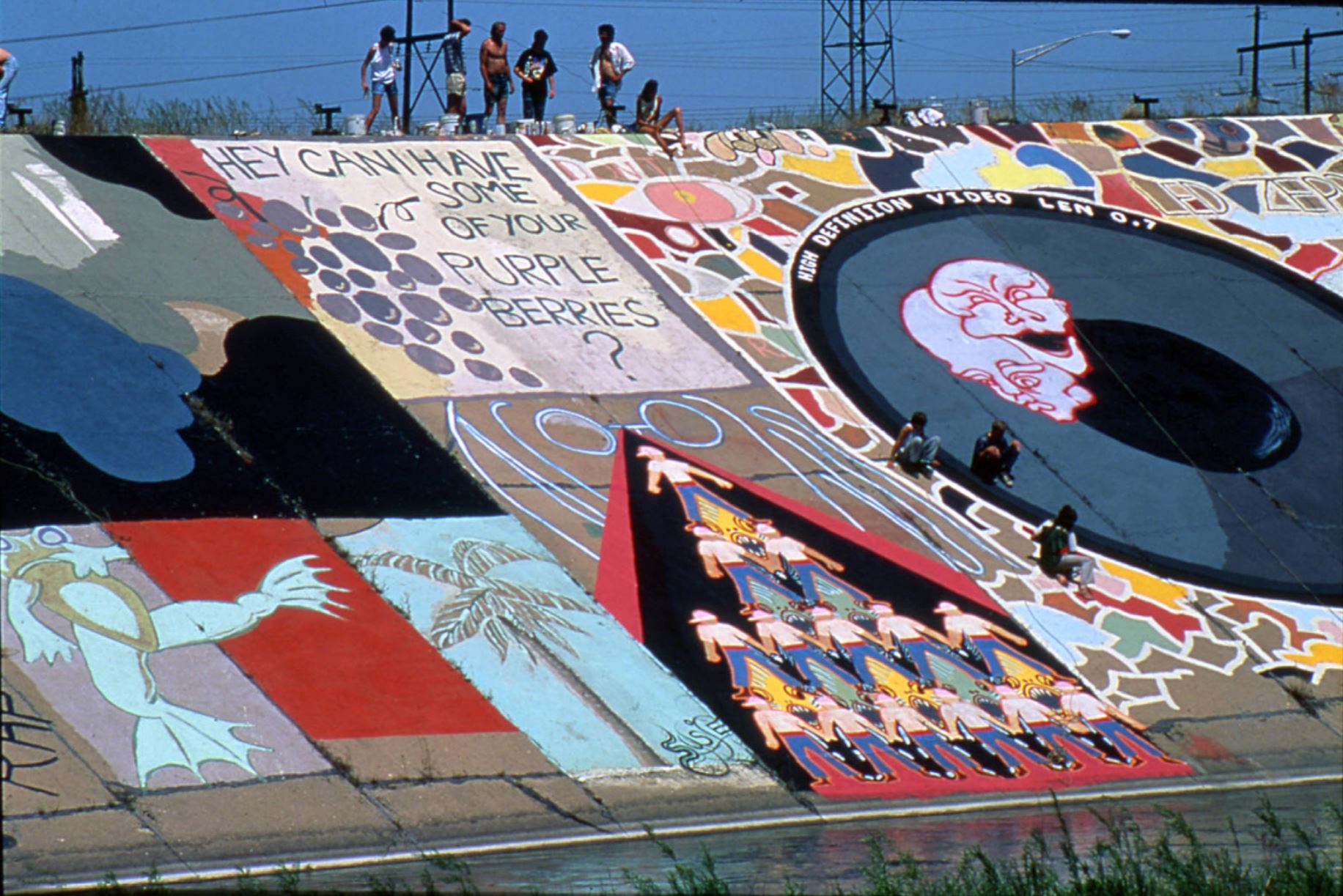 Pueblo Levee mural being painted, 1980s