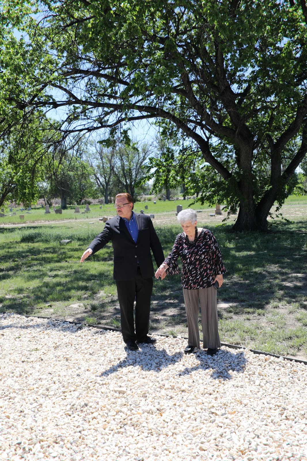Rudy Krasovec and Lucille Corsentino point out the location of the mass burial.
