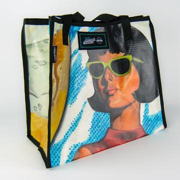 History Colorado Tote Bag, with the image of a woman wearing sunglasses on the exterior.