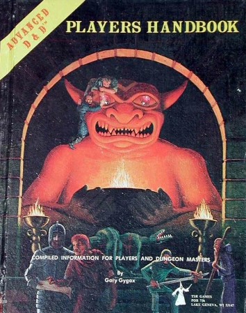 Photo of a book. Its cover is black, with an illustration of a red monster in the center, and a handful of men in robes standing nearby. Two men try to scale the monster statue, which appears to be holding a chalice of fire in its hands. Words across the top say "Advanced D&D Players Handbook." Across the bottom it says "Compiled information for players and dungeon masters by Gary Gygax."