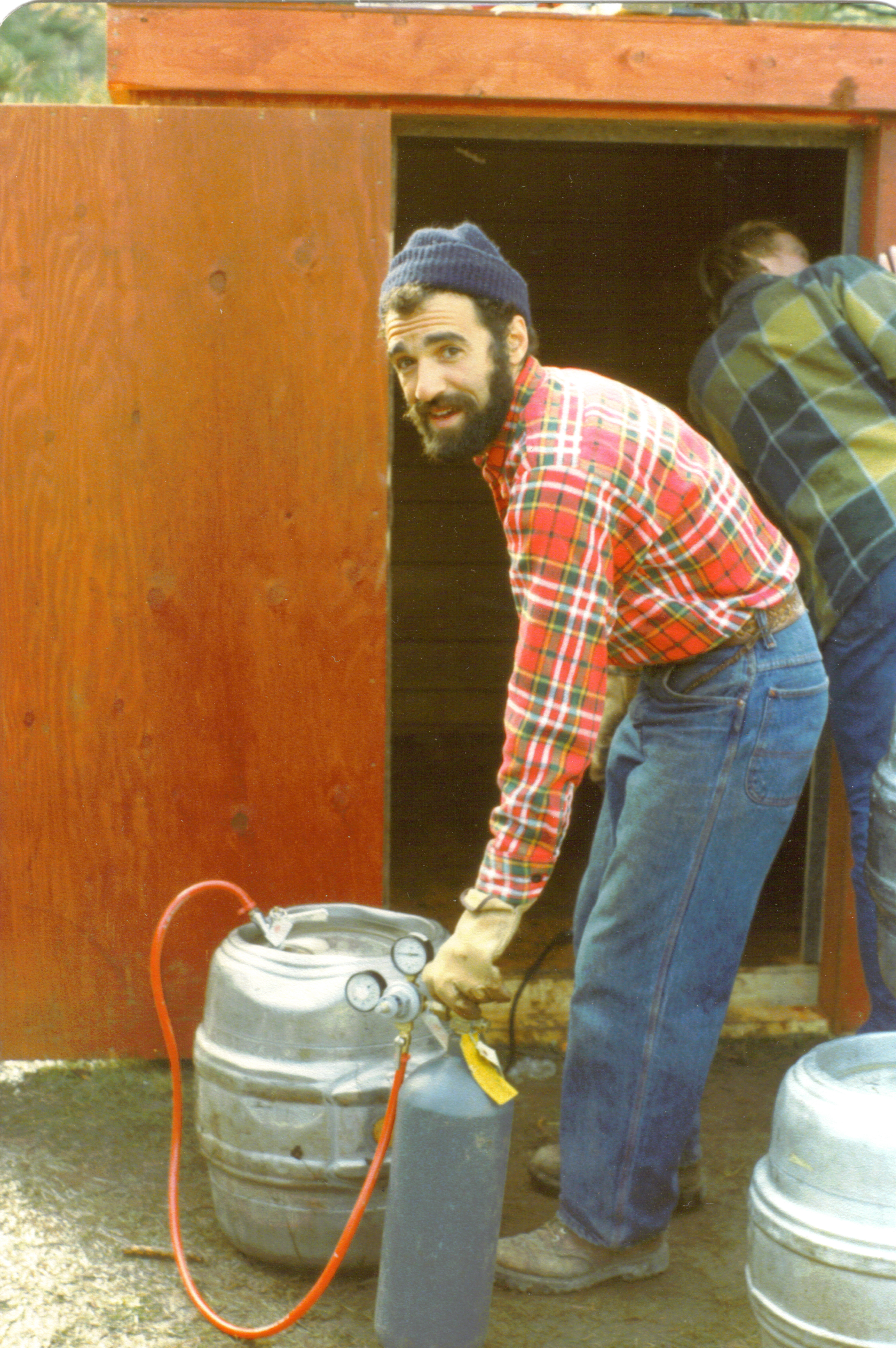 Charlie Papazian pressurizes a keg in the late 1970s.