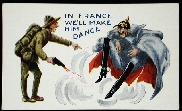 Image of a postcard with color illustration from World War One. On a stark white background, an Allied soldier in green stands on the left, pointing and smiling while holding a pistol in his right hand that is firing at the ground in front of the Nazi character on the right of the image. The caption above the image says "In France We'll Make Him Dance." The Nazi soldier, in his helmet, jacket, and tall black boots, looks dismayed as he jumps in the air to avoid the bullets being fired at his feet.