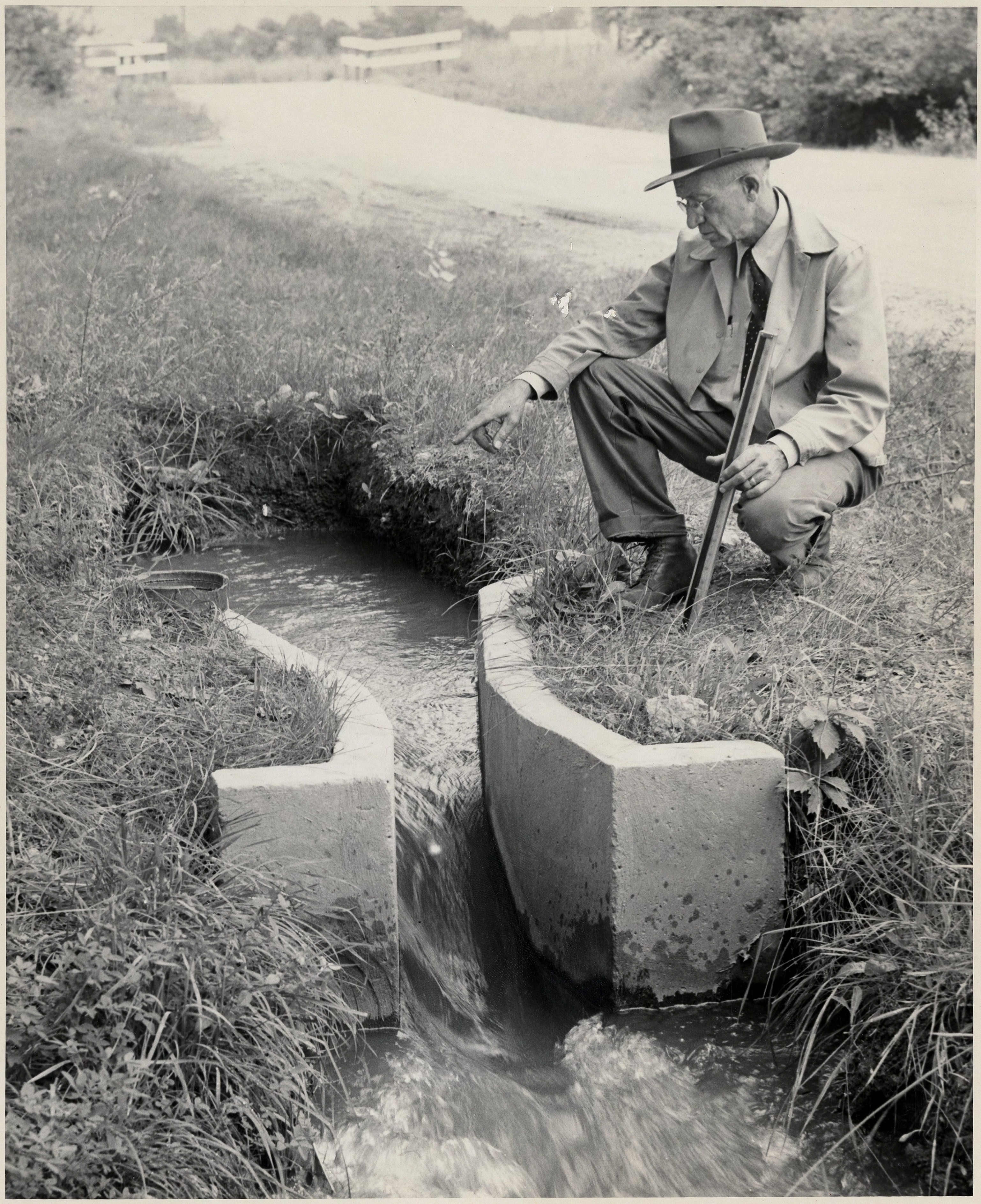 Ralph Parshall checks on one of his flumes.