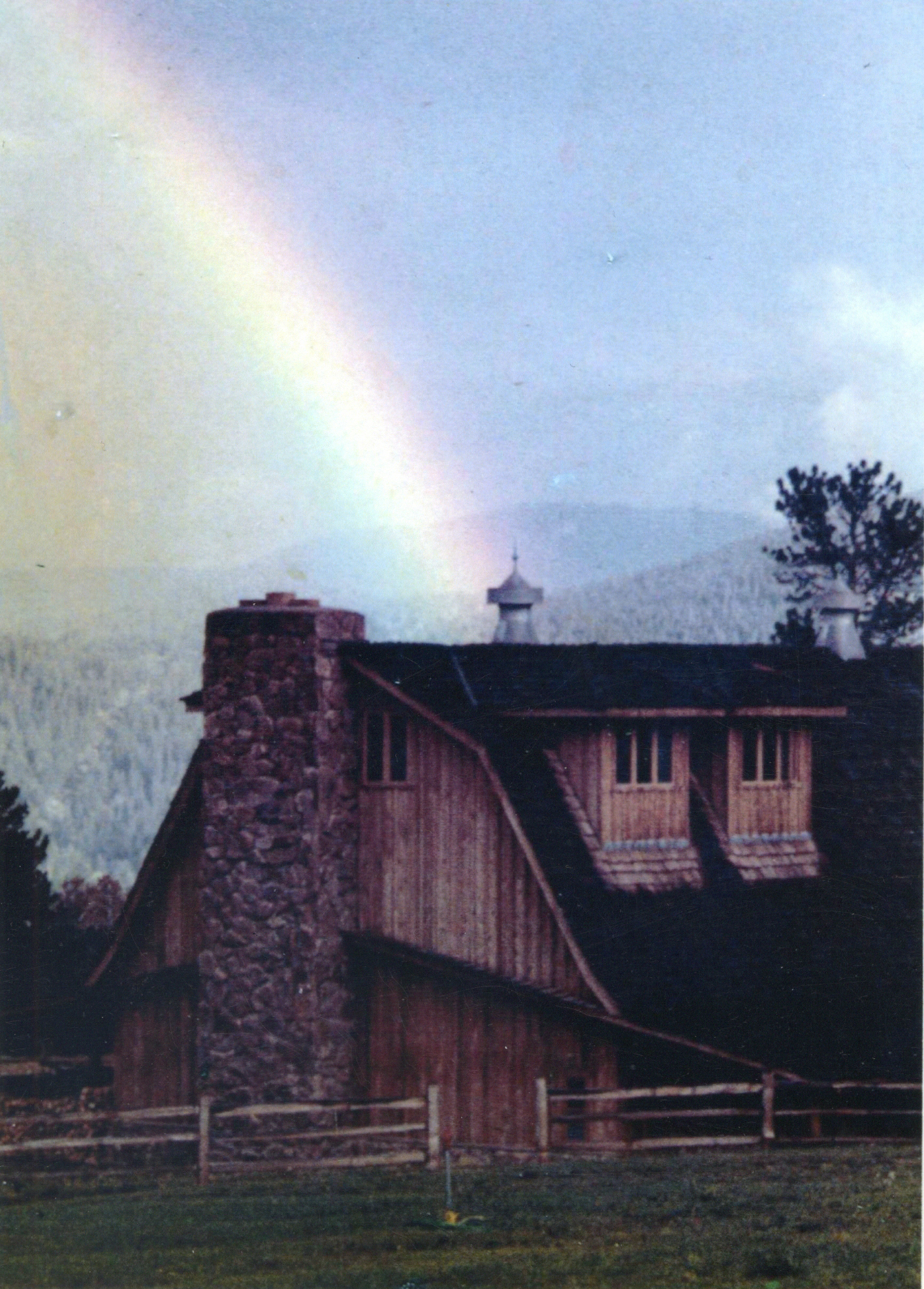 A rainbow stretches over Caribou Ranch in the mid-1970s.