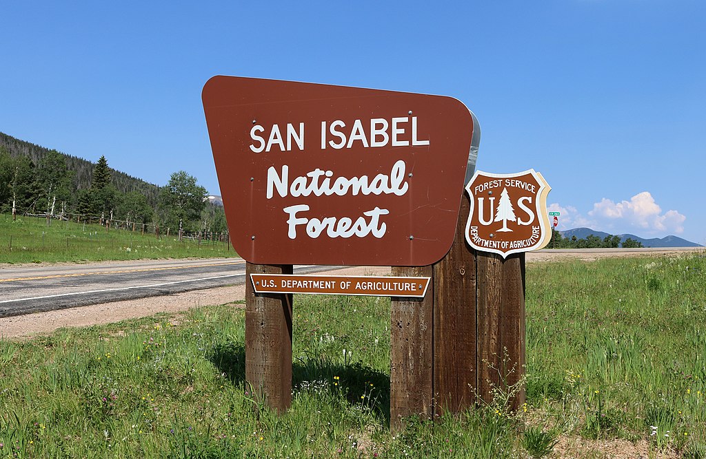 A sign marking an entrance to the San Isabel National Forest at the top of Cucharas Pass. 8 July 2017.