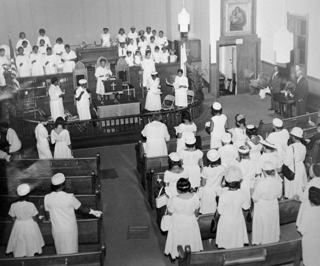 Congregation of St. Paul AME Church at a worship service. 