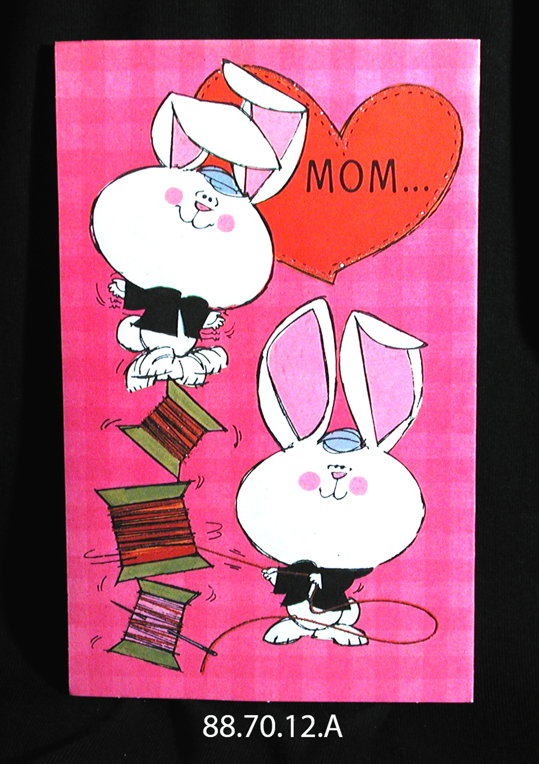A valentine card depicting rabbits, with the word "Mom" in a heart.