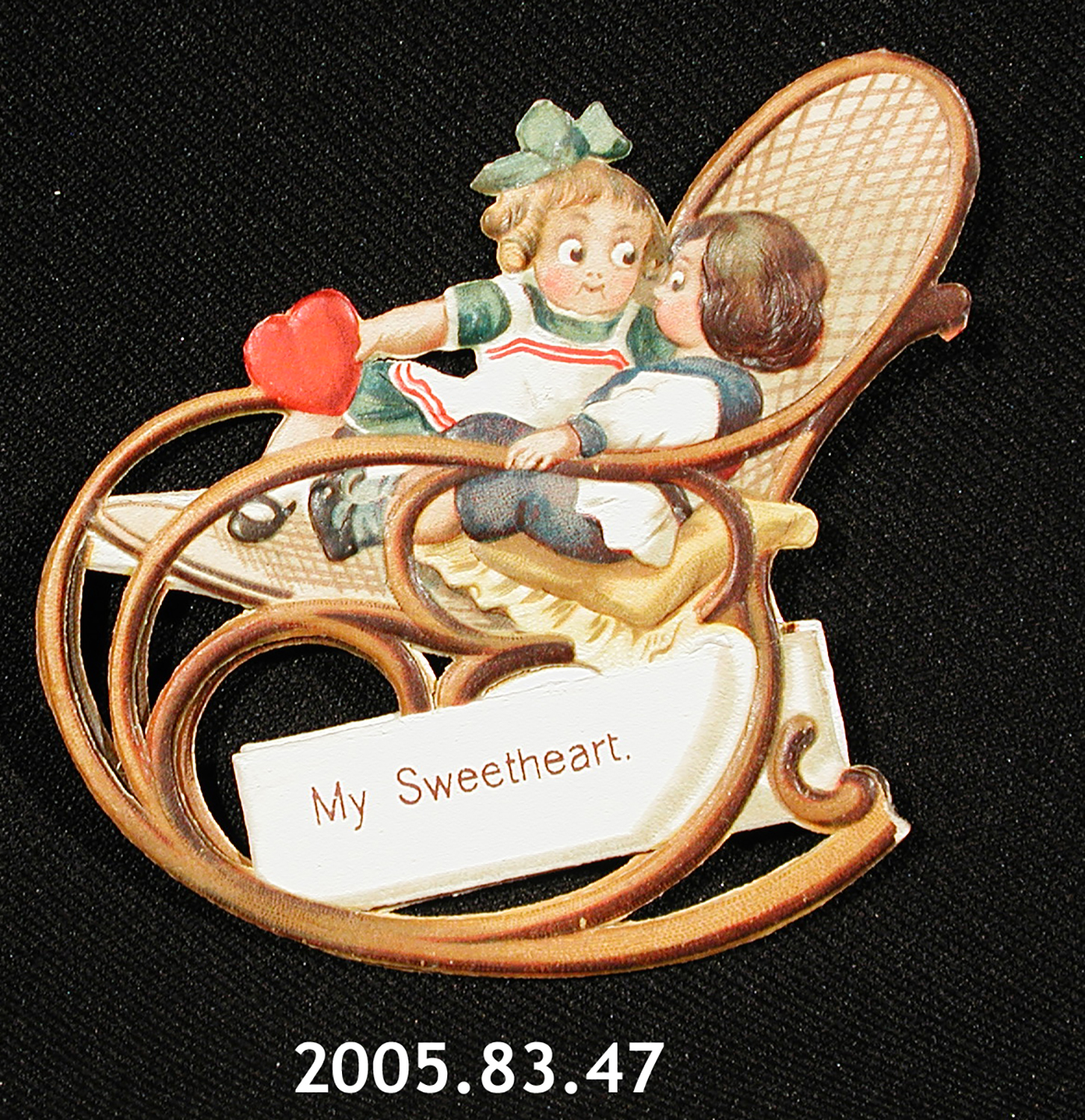 A valentine card depicting two children in a rocking chair. It reads: "My sweetheart."