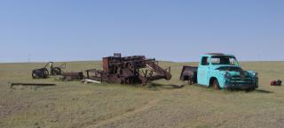 Abandoned farm equipment, including an old pickup truck, at a site on the Pawnee National Grassland.