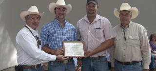 Magnuson Farm members receiving the Centennial Farm Award.