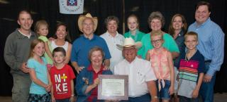 Family from the Ament Farm with their Centennial Farm award.