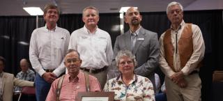Members of the Houseweart Ranch receive their award.