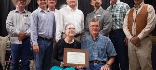 Kirkendall Farm and Ranch members receive their award.