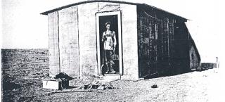 Vern Schrack in the original house on the ranch, 1917.