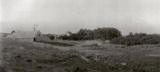 Historic photo of the RLS Ranch taken between 1910 and 1915.  A number of buildings are shown including the bank barn and the original house.
