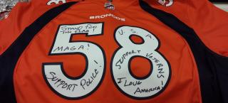 Von Miller #58 Broncos jersey covered in writing