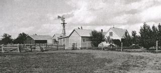 Historic image of house and buildings on the Deterding Farm.