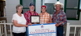 Members of the Shapley Ranch family with their plaque.