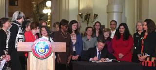 Governor signing executive order creating the Women’s Vote Centennial Commission