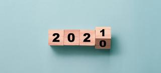 Flipping of wooden cubes block to change 2020 to 2021 year.