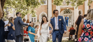 Bride and groom walking down the aisle at outdoor wedding at Grant-Humphreys Mansion